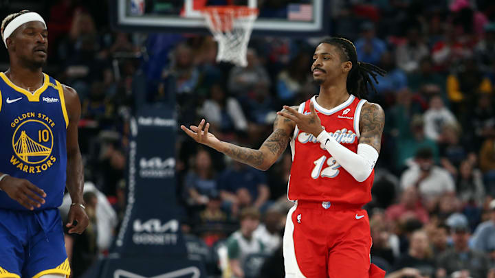 Apr 1, 2025; Memphis, Tennessee, USA; Memphis Grizzlies guard Ja Morant (12) reacts toward Golden State Warriors forward Jimmy Butler III (10) after a basket during the second quarter at FedExForum. Mandatory Credit: Petre Thomas-Imagn Images Apr 1, 2025; Memphis, Tennessee, USA; Memphis Grizzlies guard Ja Morant (12) reacts toward Golden State Warriors forward Jimmy Butler III (10) after a basket during the second quarter at FedExForum. Mandatory Credit: Petre Thomas-Imagn Images