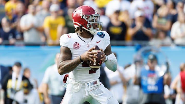Dec 31, 2024; Tampa, FL, USA; Alabama Crimson Tide quarterback Jalen Milroe (4) looks to throw against the Michigan Wolverines during the second half at Raymond James Stadium. Mandatory Credit: Matt Pendleton-Imagn Images