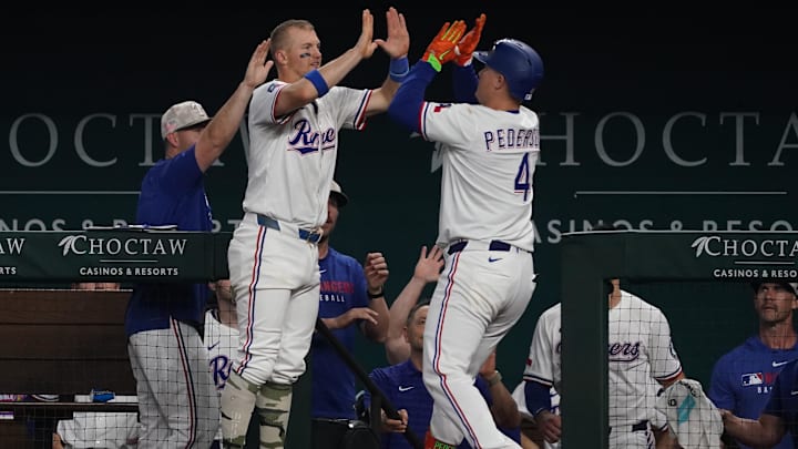 May 17, 2025; Arlington, Texas, USA; Texas Rangers first baseman Joc Pederson (4) is greeted by third baseman Josh Jung (6) after hitting a two-run home run sixth inning against the Houston Astros at Globe Life Field. Mandatory Credit: Raymond Carlin III-Imagn Images May 17, 2025; Arlington, Texas, USA; Texas Rangers first baseman Joc Pederson (4) is greeted by third baseman Josh Jung (6) after hitting a two-run home run sixth inning against the Houston Astros at Globe Life Field. Mandatory Credit: Raymond Carlin III-Imagn Images