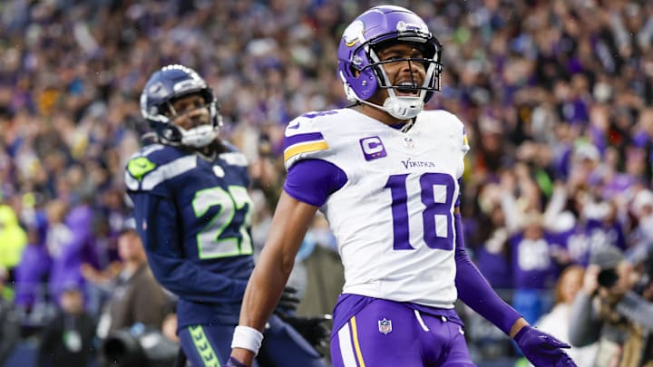 Dec 22, 2024; Seattle, Washington, USA; Minnesota Vikings wide receiver Justin Jefferson (18) celebrates after catching a touchdown pass against the Seattle Seahawks during the fourth quarter at Lumen Field.