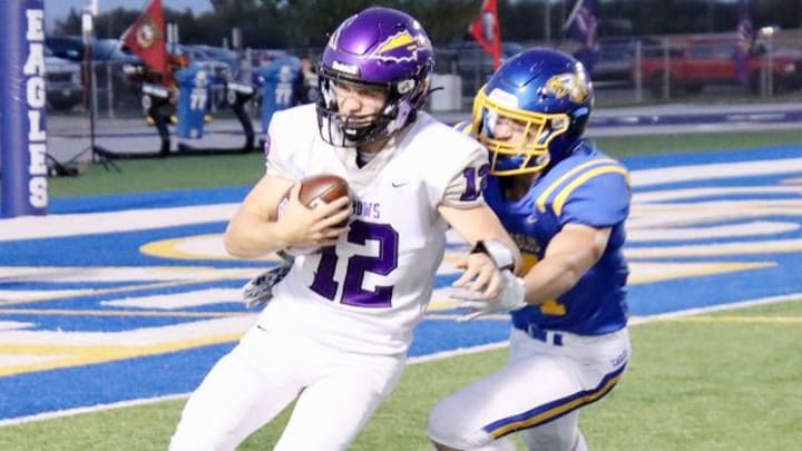 Watertown quarterback Treyton Himmerich attempts to elude an Aberdeen Central defender during an Eastern South Dakota Conference high school football game against Aberdeen Central on Friday, Sept. 29, 2023 at Aberdeen.
