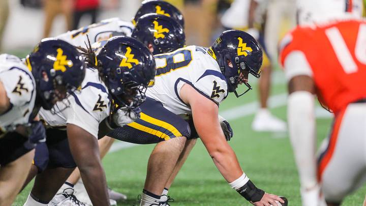 Sep 19, 2026; Charlotte, North Carolina, USA; West Virginia Mountaineers offensive lineman Wes King (78) pauses over center before a snap during the third quarter against the Virginia Cavaliers at Bank of America Stadium. Mandatory Credit: Ben Queen-Imagn Images Sep 19, 2026; Charlotte, North Carolina, USA; West Virginia Mountaineers offensive lineman Wes King (78) pauses over center before a snap during the third quarter against the Virginia Cavaliers at Bank of America Stadium. Mandatory Credit: Ben Queen-Imagn Images