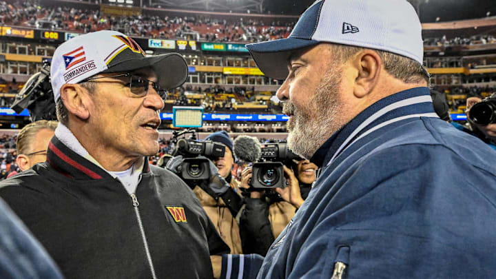 LANDOVER, MD - JANUARY 07: Washington Commanders head coach Ron Rivera (L) congratulates Dallas Cowboys head coach Mike McCarthy (R) following the NFL game between the Dallas Cowboys and the Washington Commanders on January 7, 2024 at Fed Ex Field in Landover, MD. 