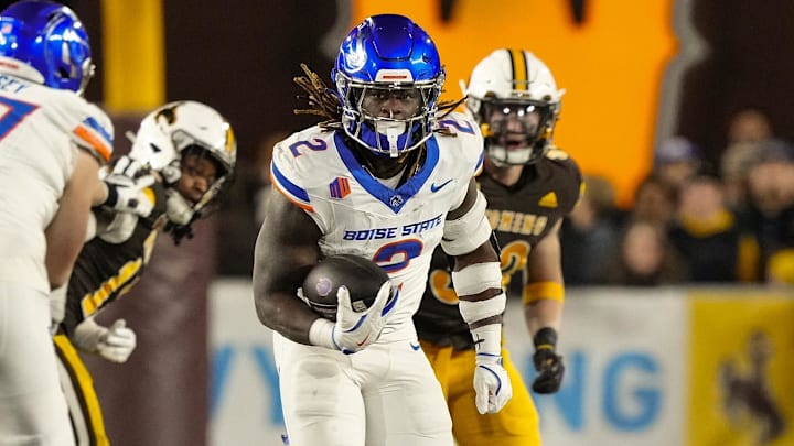 Nov 23, 2024; Laramie, Wyoming, USA; Boise State Broncos running back Ashton Jeanty (2) runs for a touchdown against the Wyoming Cowboys during the first quarter at Jonah Field at War Memorial Stadium. Mandatory Credit: Troy Babbitt-Imagn Images

