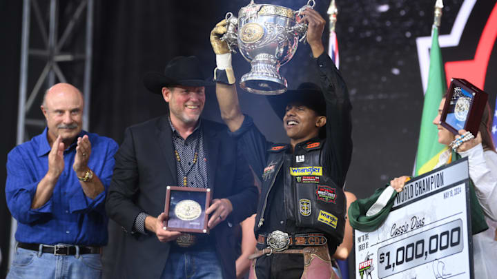 Dr. Phil on stage with PBR World Champion Cassio Dias Dr. Phil on stage with PBR World Champion Cassio Dias