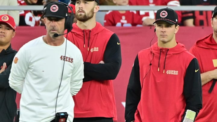 San Francisco 49ers quarterback Brock Purdy (right) and head coach Kyle Shanahan (left) look on in the second half against the Arizona Cardinals at State Farm Stadium.