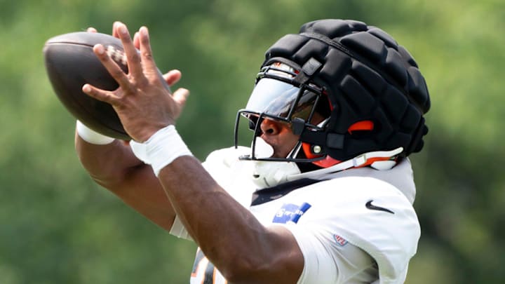 Cincinnati Bengals running back Chris Evans (25) catches a pass at Cincinnati Bengals training camp on the Kettering Health Practice Fields in Cincinnati on Sunday, Aug. 4, 2024. Cincinnati Bengals running back Chris Evans (25) catches a pass at Cincinnati Bengals training camp on the Kettering Health Practice Fields in Cincinnati on Sunday, Aug. 4, 2024.