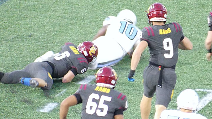 Cole Thomas tackles Ansu Sanoe during Central Catholic's win over Lakeridge on Friday.
