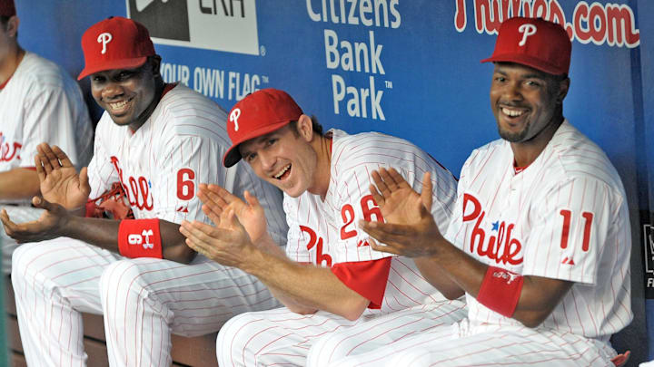 August 10, 2012; Philadelphia, PA USA; Philadelphia Phillies first baseman Ryan Howard (6), second baseman Chase Utley (26) and shortstop Jimmy Rollins (11) applaud former Phillies teammate Mike Lieberthal (not pictured) who was inducted into the Phillies 'Wall of Fame' before the game against the St. Louis Cardinals during game at Citizens Bank Park. Mandatory Credit: Eric Hartline-Imagn Images August 10, 2012; Philadelphia, PA USA; Philadelphia Phillies first baseman Ryan Howard (6), second baseman Chase Utley (26) and shortstop Jimmy Rollins (11) applaud former Phillies teammate Mike Lieberthal (not pictured) who was inducted into the Phillies 'Wall of Fame' before the game against the St. Louis Cardinals during game at Citizens Bank Park. Mandatory Credit: Eric Hartline-Imagn Images