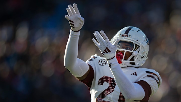 Mississippi State's running back Davon Booth (21) celebrates a touchdown during the Egg Bowl game against Mississippi at Vaught-Hemingway Stadium on Friday, Nov. 29, 2024.