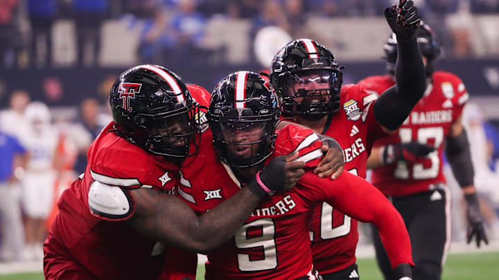 Texas Tech players Lee Hunter (left) and Jacob Rodriguez (back) celebrate Romello Height's fumble recover against BYU during the Big 12 Conference championship football game, Saturday, Nov. 6, 2025, at AT&T Stadium in Arlington. Texas Tech players Lee Hunter (left) and Jacob Rodriguez (back) celebrate Romello Height's fumble recover against BYU during the Big 12 Conference championship football game, Saturday, Nov. 6, 2025, at AT&T Stadium in Arlington.