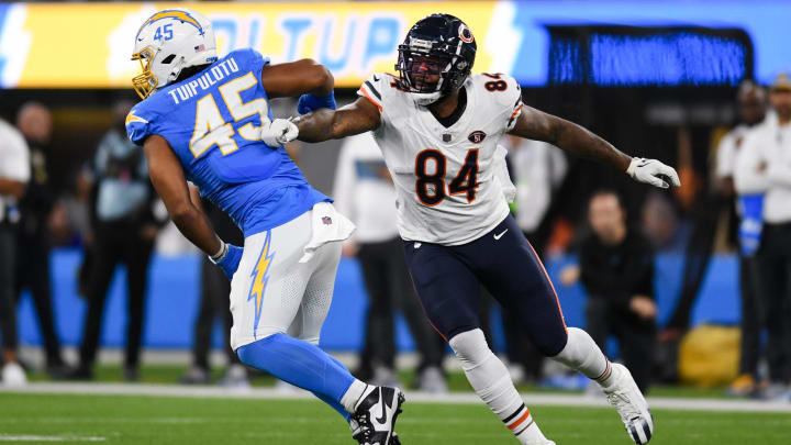 Oct 29, 2023; Inglewood, California, USA; Chicago Bears tight end Marcedes Lewis (84) attempts to block Los Angeles Chargers linebacker Tuli Tuipulotu (45) during second quarter at SoFi Stadium. Mandatory Credit: Jonathan Hui-USA TODAY Sports