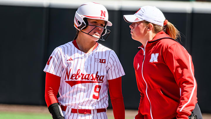 Hannah Camenzind confers with assistant coach Olivia Ferrell after a single. 