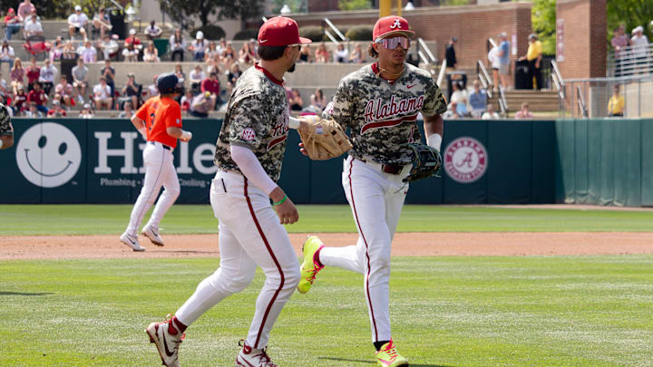 Alabama infielders Justin Lebron and Jason Torres jog back to the dugout in the third game of the series against Auburn on Mar.29, 2026.