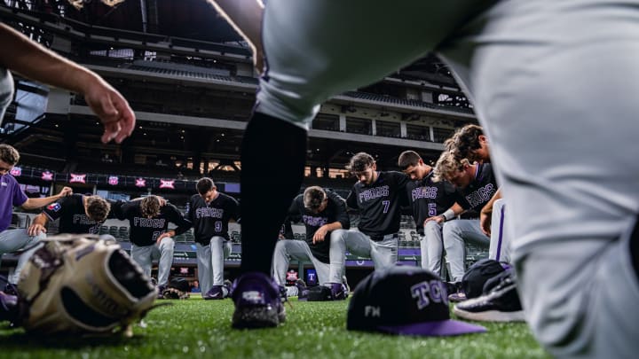 TCU Baseball team prays before final game of the season.