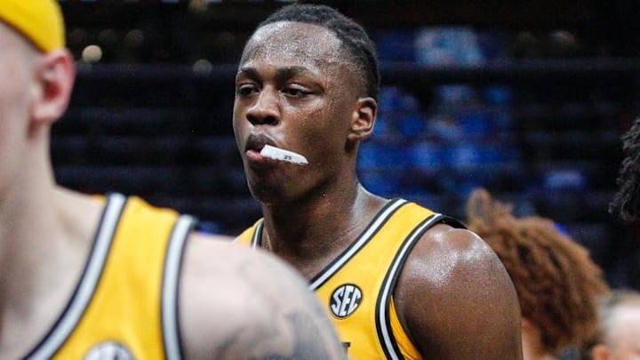 Dec 22, 2025; St. Louis, Missouri, USA; Missouri Tigers forward Mark Mitchell walks to the bench during a timeout in a game against Illinois at the Enterprise Center