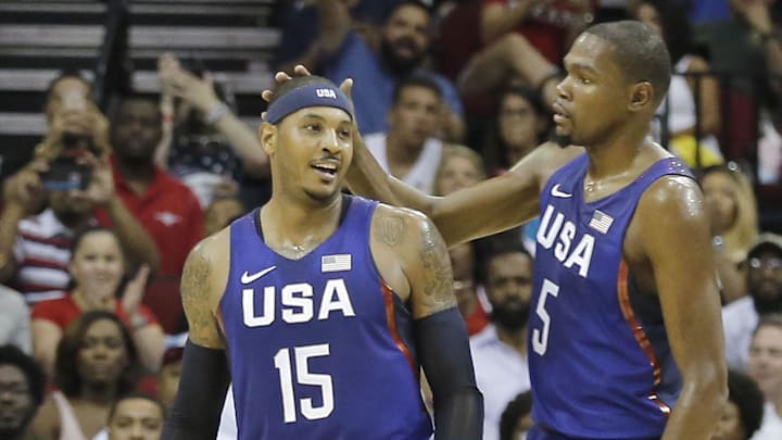 Aug 1, 2016; Houston, TX, USA; United States guard Kevin Durant (5) congratulates  forward Carmelo Anthony (15) after making a basket against Nigeria in the second quarter during an exhibition basketball game between United States and Nigeria at Toyota Center. Mandatory Credit: Thomas B. Shea-Imagn Images