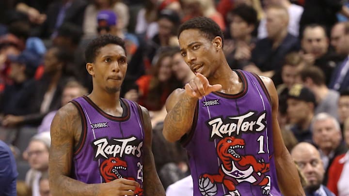 Mar 13, 2015; Toronto, Ontario, CAN; Toronto Raptors guard DeMar DeRozan (10) gives instructions to guard Lou Williams (23) against the Miami Heat at Air Canada Centre. The Raptors beat the Heat 102-92. Mandatory Credit: Tom Szczerbowski-Imagn Images