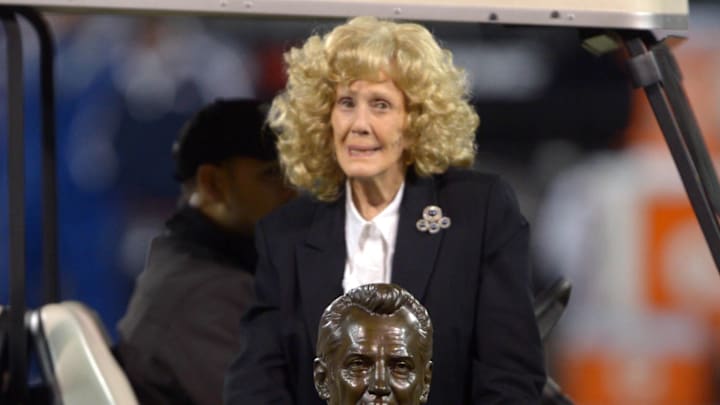 Dec 6, 2012; Oakland, CA, USA; Carol Davis poses with the Hall of Fame bust of her late husband and Oakland Raiders owner Al Davis (not pictured) during halftime of the game against the Denver Broncos at the O.co Coliseum. Mandatory Credit: Kirby Lee/Image of Sport-Imagn Images