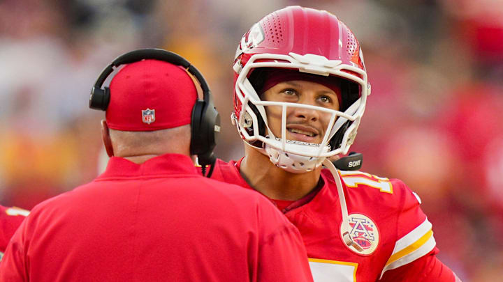 Sep 28, 2025; Kansas City, Missouri, USA; Kansas City Chiefs quarterback Patrick Mahomes (15) talks with head coach Andy Reid during the second half against the Baltimore Ravens at GEHA Field at Arrowhead Stadium. Mandatory Credit: Jay Biggerstaff-Imagn Images