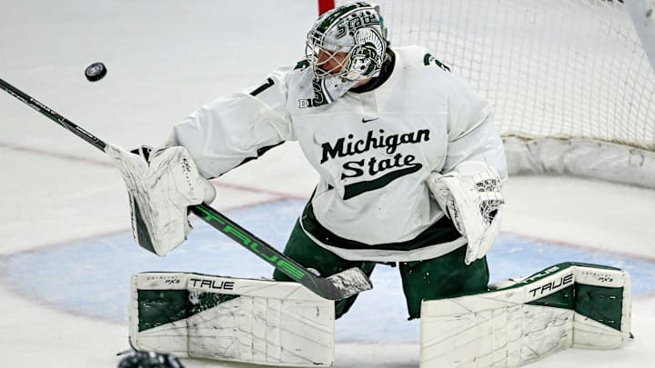 Michigan State's Trey Augustine deflects a Minnesota shot during overtime on Saturday, Jan. 25, 2025, at Munn Arena in East Lansing. Michigan State's Trey Augustine deflects a Minnesota shot during overtime on Saturday, Jan. 25, 2025, at Munn Arena in East Lansing.