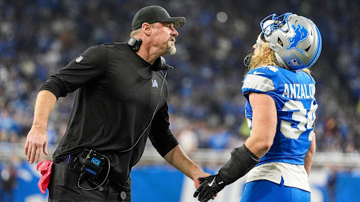 Detroit Lions head coach Dan Campbell shakes hands with linebacker Alex Anzalone (34) after a play against Washington Commanders during the first half of the NFC divisional round at Ford Field in Detroit on Saturday, Jan. 18, 2025.
