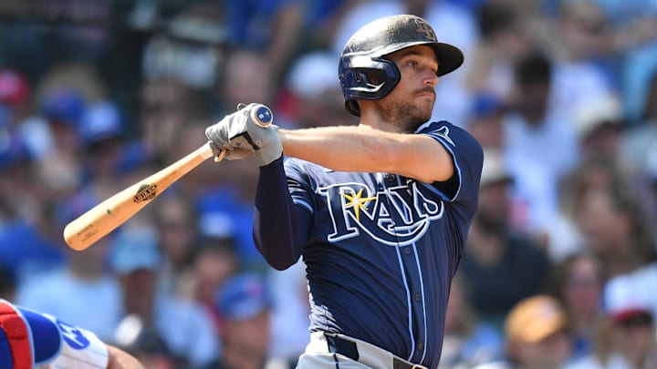 Sep 13, 2025; Chicago, Illinois, USA; Tampa Bay Rays second baseman Brandon Lowe (8) hits an RBI single against the Chicago Cubs during the sixth inning at Wrigley Field. Mandatory Credit: Patrick Gorski-Imagn Images