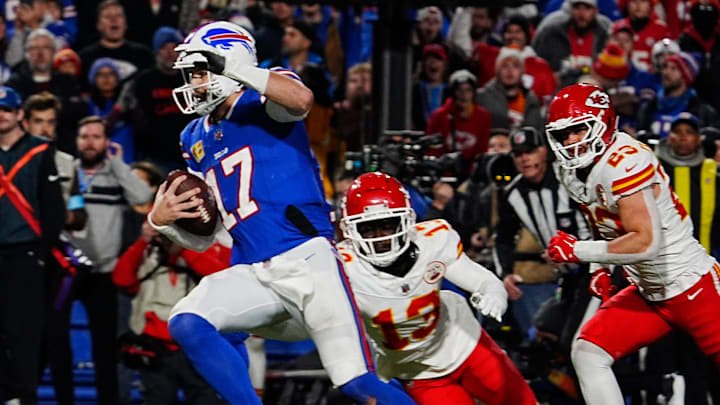 Bills quarterback Josh Allen avoids Kansas City's Nazeeh Johnson and Drue Tranquill on his late fourth quarter touchdown carry into the end zone in Orchard Park, Nov.17, 2024.