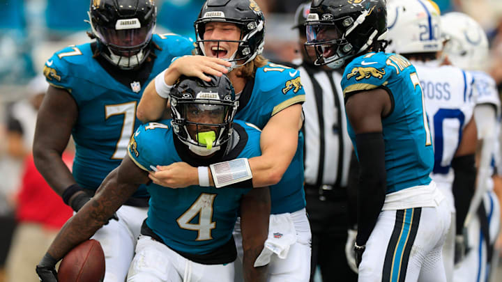 Jacksonville Jaguars quarterback Trevor Lawrence (16) celebrates a touchdown scored by running back Tank Bigsby (4) during the third quarter of NFL football matchup Sunday, Oct. 6, 2024 at EverBank Stadium in Jacksonville, Fla. The Jaguars edged the Colts on a field goal 37-34.