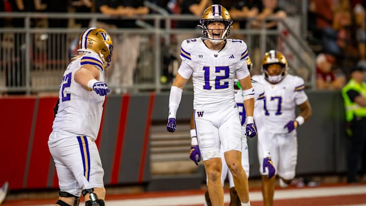 Alex McLaughlin celebrates his 47-yard interception return for a touchdown in the Apple Cup. 