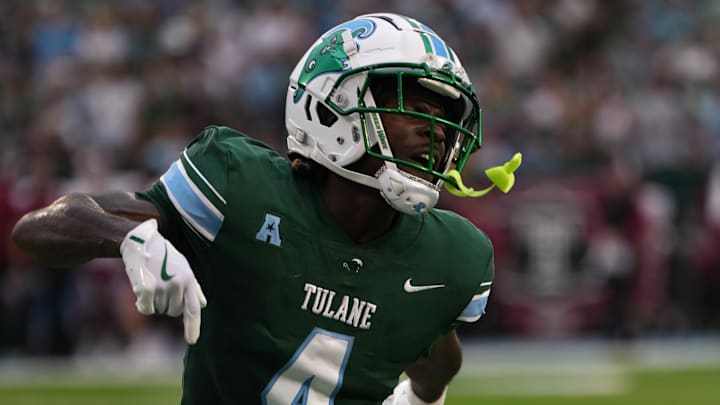 A Tulane Green Wave football player celebrates A Tulane Green Wave football player celebrates