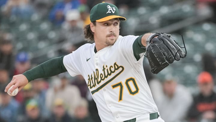 Apr 24, 2025; West Sacramento, California, USA; Athletics pitcher J.T. Ginn (70) throws a pitch against the Texas Rangers during the first inning at Sutter Health Park. Mandatory Credit: Ed Szczepanski-Imagn Images