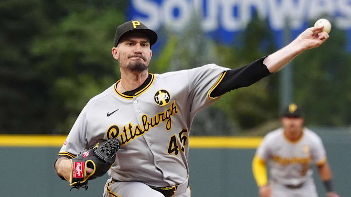 Aug 1, 2025; Denver, Colorado, USA; Pittsburgh Pirates starting pitcher Andrew Heaney (45) delivers a pitch in the first inning against the Colorado Rockies at Coors Field. Mandatory Credit: Ron Chenoy-Imagn Images