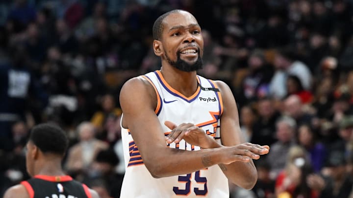 Feb 23, 2025; Toronto, Ontario, CAN;  Phoenix Suns forward Kevin Durant (35) gestures to the referee for a foul call against the Toronto Raptors in the second half at Scotiabank Arena. Mandatory Credit: Dan Hamilton-Imagn Images