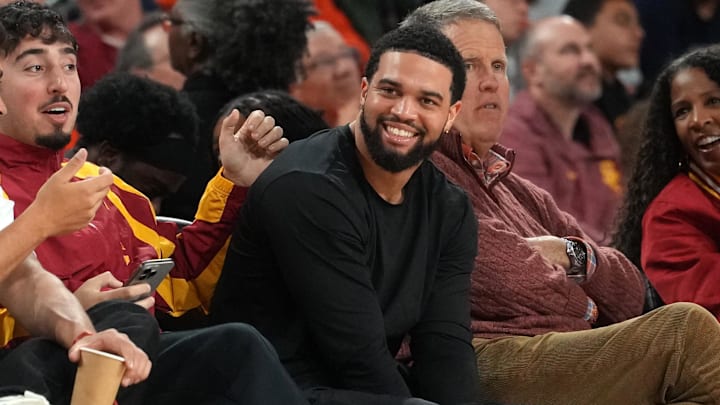 Quarterback Caleb Williams watches the second half of the USC-Illinois basketball game at Galen Center in California.
