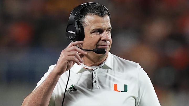 Dec 28, 2024; Orlando, FL, USA; Miami Hurricanes head coach Mario Cristobal walks on the field during the second half against the Iowa State Cyclones at Camping World Stadium. Mandatory Credit: Jasen Vinlove-Imagn Images