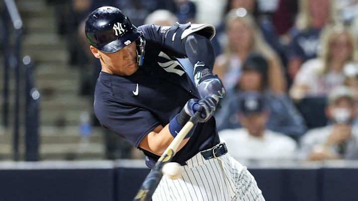 Mar 14, 2025; Tampa, Florida, USA; New York Yankees outfielder Aaron Judge (99) singles against the Philadelphia Phillies in the sixth inning during spring training at George M. Steinbrenner Field. Mar 14, 2025; Tampa, Florida, USA; New York Yankees outfielder Aaron Judge (99) singles against the Philadelphia Phillies in the sixth inning during spring training at George M. Steinbrenner Field.