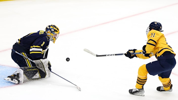 Apr 6, 2023; Tampa, Florida, USA; Quinnipiac forward Collin Graf (11) shoots the puck on Michigan