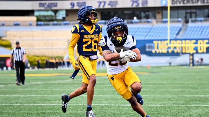Diore Hubbard runs for a touchdown during the 2025 West Virginia Gold-Blue Spring Showcase.
