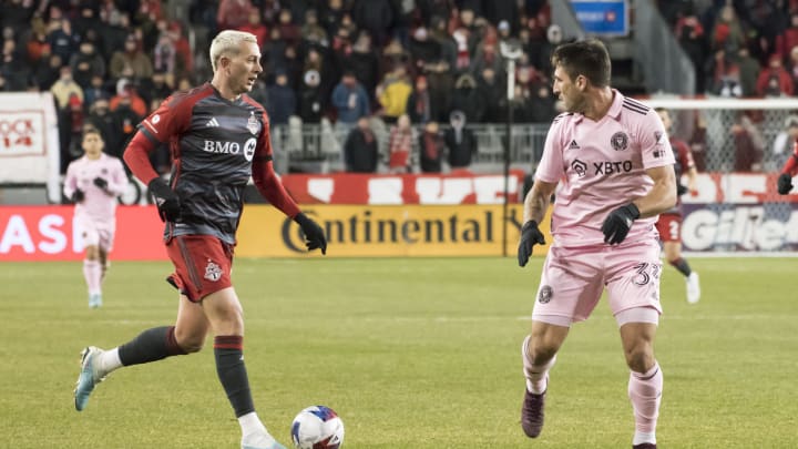 Federico Bernardeschi #10 (L) and Franco Negri #33 (R) seen...