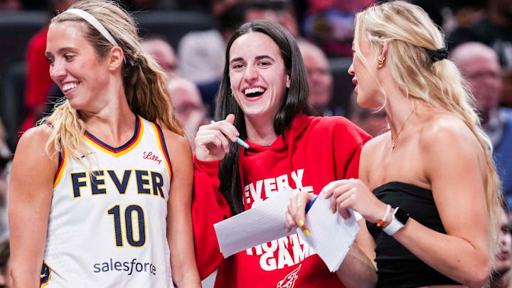 Indiana Fever guard Lexie Hull (10), Indiana Fever guard Caitlin Clark (22), and Indiana Fever guard Sophie Cunningham (8) laugh near the team bench Tuesday, June 3, 2025, during a game between the Indiana Fever and the Washington Mystics at Gainbridge Fieldhouse in Indianapolis.