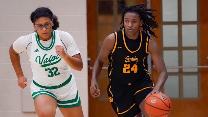 Fort Wayne Schneider’s Janaya Cooper (24) is chased by Valparaiso’s Delilah Kincaid (32) during a game between the Valparaiso High School Vikings vs. the Fort Wayne Snider Panthers on Saturday, Dec. 28, 2024, at Noblesville High School in Noblesville Indiana. The game was part of the Noblesville Holiday Tournament at The Mill.