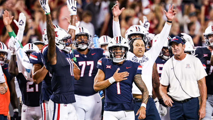 Sep 12, 2025; Tucson, Arizona, USA; Arizona Wildcats quarterback Noah Fifita (1) and teammates celebrate after the touchdown they made is confirmed by replay against the Kansas State Wildcats during the second quarter of the game at Arizona Stadium. Mandatory Credit: Aryanna Frank-Imagn Images Sep 12, 2025; Tucson, Arizona, USA; Arizona Wildcats quarterback Noah Fifita (1) and teammates celebrate after the touchdown they made is confirmed by replay against the Kansas State Wildcats during the second quarter of the game at Arizona Stadium. Mandatory Credit: Aryanna Frank-Imagn Images