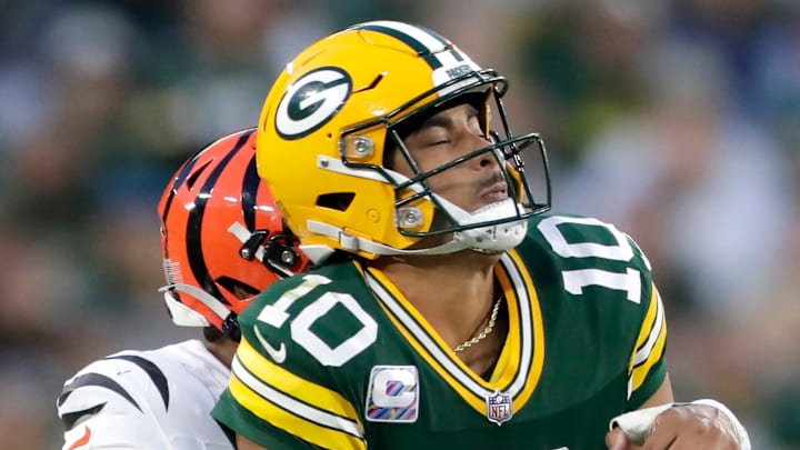 Cincinnati Bengals safety Geno Stone (22) sacks Green Bay Packers quarterback Jordan Love during the fourth quarter. Cincinnati Bengals safety Geno Stone (22) sacks Green Bay Packers quarterback Jordan Love during the fourth quarter.