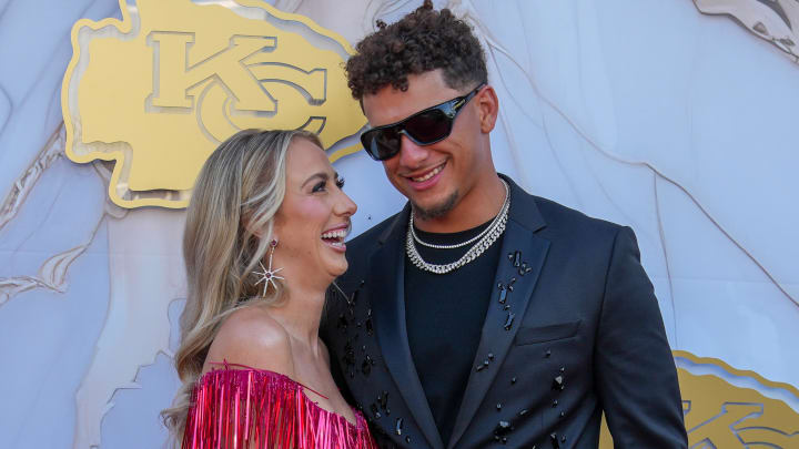 Jun 13, 2024; Kansas City, MO, USA; Kansas City Chiefs quarterback Patrick Mahomes and wife Britney laugh while posing for a photo on the red carpet at the Nelson-Akins Museum of Art. Mandatory Credit: Denny Medley-USA TODAY Sports