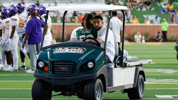 Sep 12, 2026; Waco, Texas, USA; Baylor Bears defensive lineman Devonte Tezino (59) is carted off the field after sustaining an injury against the Prairie View A&M Panthers during the first half at McLane Stadium. Mandatory Credit: Chris Jones-Imagn Images Sep 12, 2026; Waco, Texas, USA; Baylor Bears defensive lineman Devonte Tezino (59) is carted off the field after sustaining an injury against the Prairie View A&M Panthers during the first half at McLane Stadium. Mandatory Credit: Chris Jones-Imagn Images