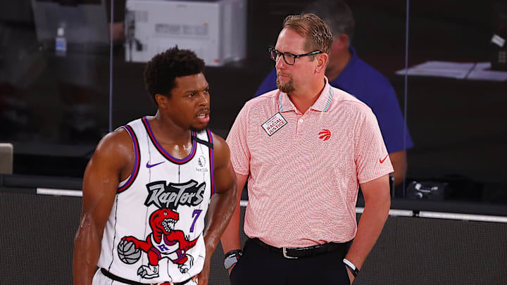 Aug 9, 2020; Lake Buena Vista, Florida, USA; Nick Nurse of the Toronto Raptors talks with Kyle Lowry #7 of the Toronto Raptors during the first quarter against the Memphis Grizzlies at Visa Athletic Center at ESPN Wide World Of Sports Complex. Mandatory Credit: Kevin C. Cox/Pool Photo-Imagn Images