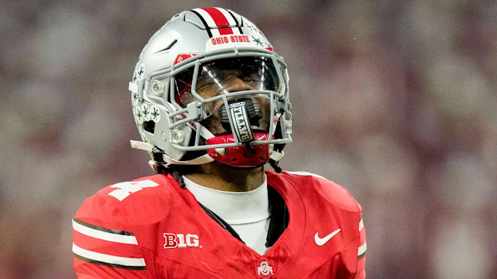 Ohio State Buckeyes wide receiver Jeremiah Smith (4) celebrates a play Saturday, Dec. 6, 2025, during the Big Ten football championship against the Indiana Hoosiers at Lucas Oil Stadium in Indianapolis.