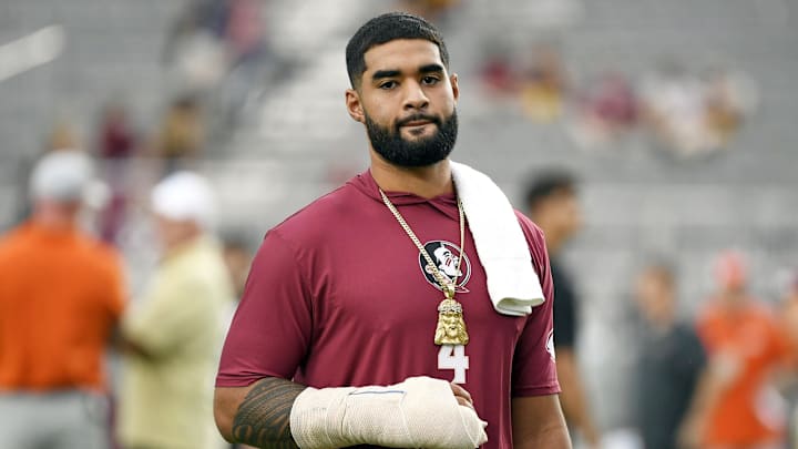 Oct 5, 2024; Tallahassee, Florida, USA; Florida State Seminoles quarterback DJ Uiagalelei (4) in an arm cast before a game against the Clemson Tigers at Doak S. Campbell Stadium. Mandatory Credit: Melina Myers-Imagn Images