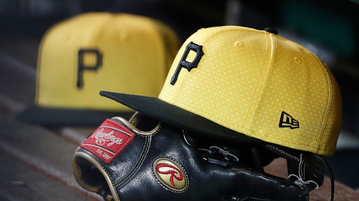 Sep 16, 2023; Pittsburgh, Pennsylvania, USA;  Pittsburgh Pirates hats and gloves in the dugout against the New York Yankees during the sixth inning at PNC Park. Mandatory Credit: Charles LeClaire-Imagn Images